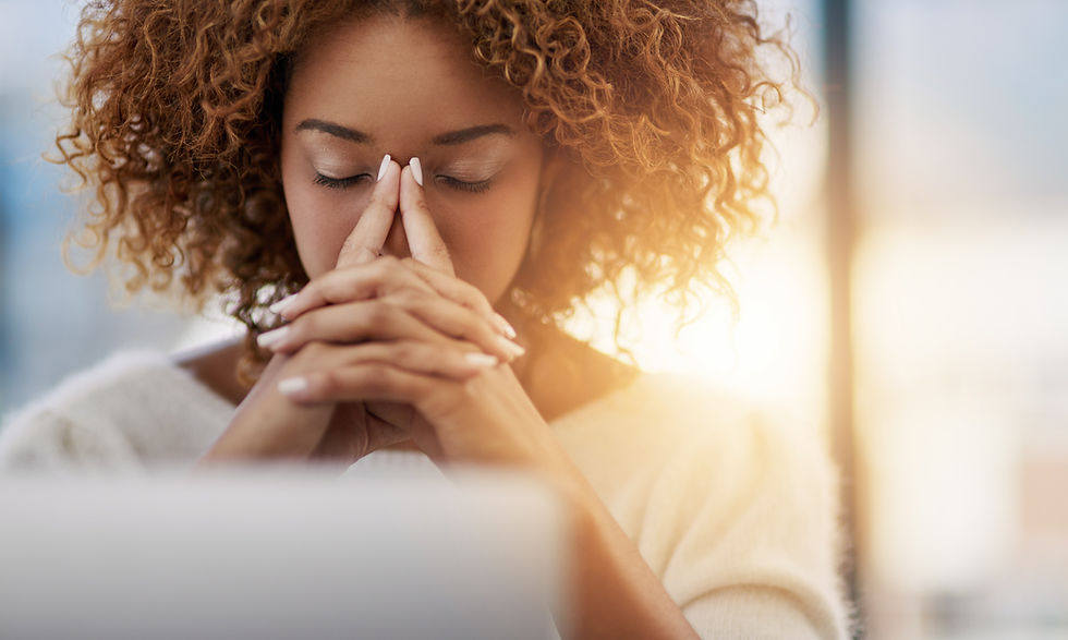 image of a black woman with her hands on her face